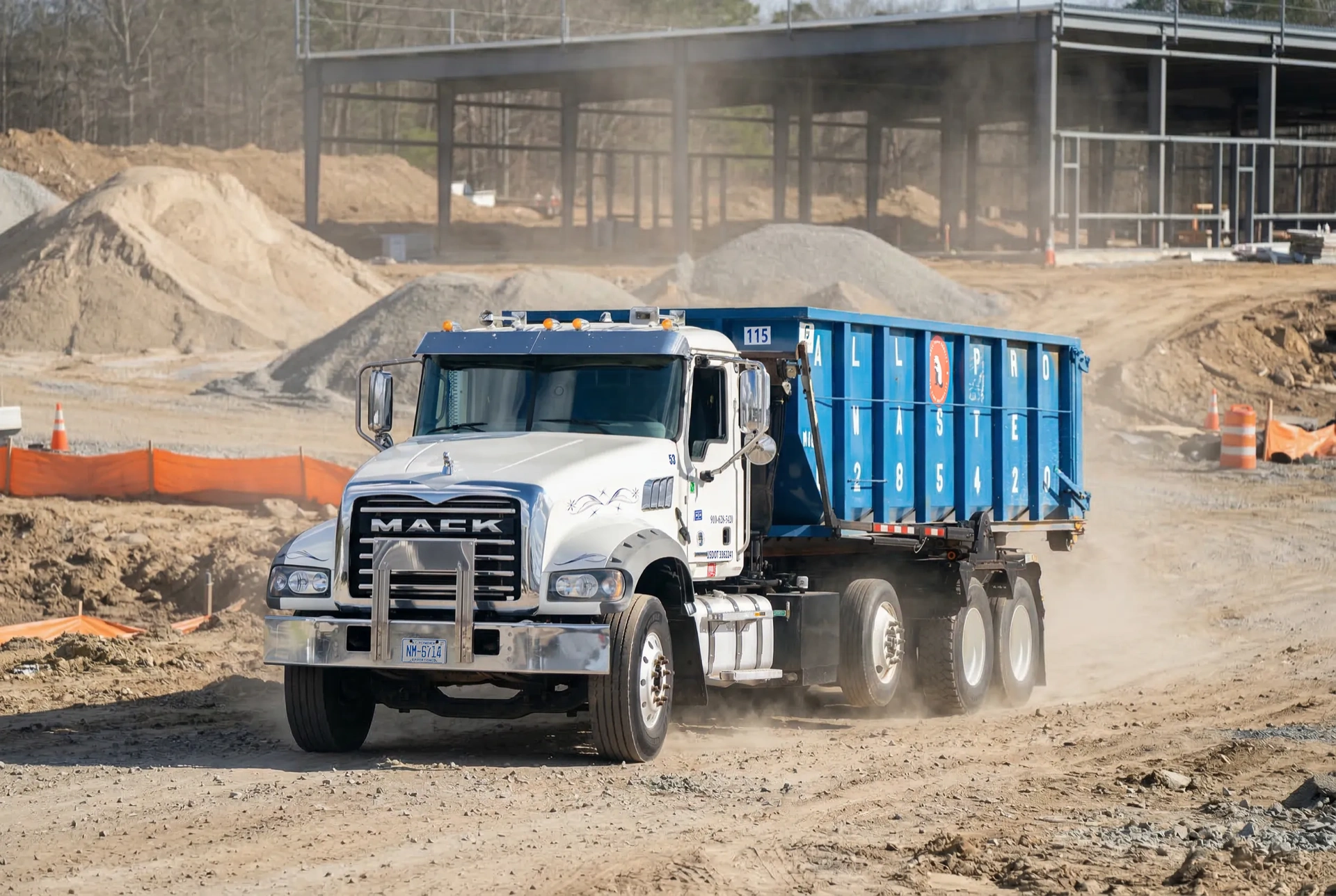 All Pro Waste roll-off dumpster on a construction site